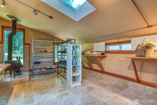 97 Snowberry Ln, Orcas Island, WA 98245 - staircase featuring a skylight, a wood stove, and vaulted ceiling