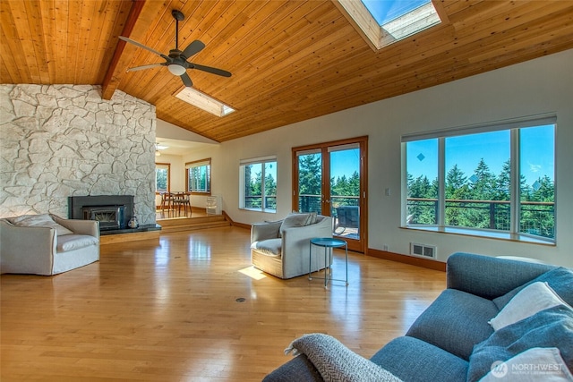 97 Snowberry Ln, Orcas Island, WA 98245 - living area featuring a skylight, a wooden ceiling with exposed beams, a ceiling fan, high vaulted ceiling, and light wood-type flooring