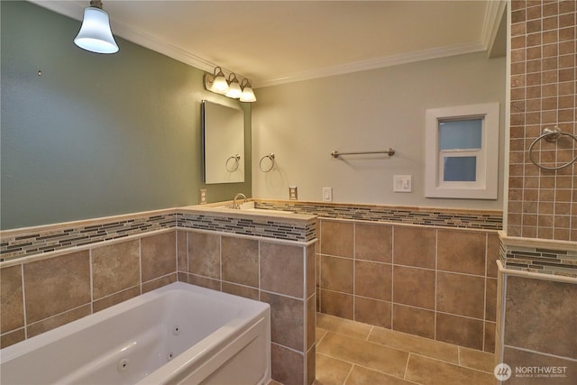 bathroom with crown molding, tile walls, a jetted tub, and a wainscoted wall