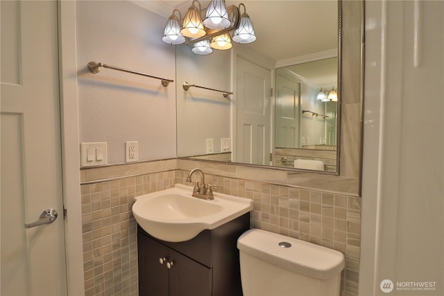 half bath featuring ornamental molding, toilet, and tile walls