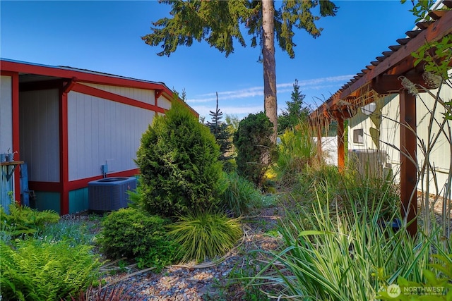 view of yard featuring central AC