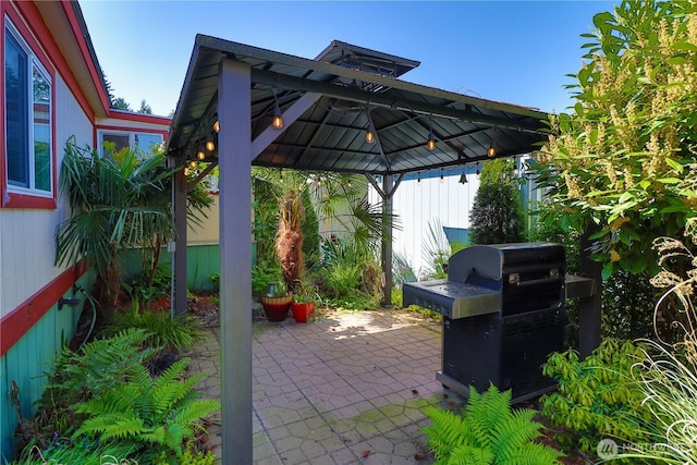 view of patio with a gazebo and area for grilling