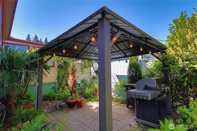 view of patio featuring a gazebo and a grill