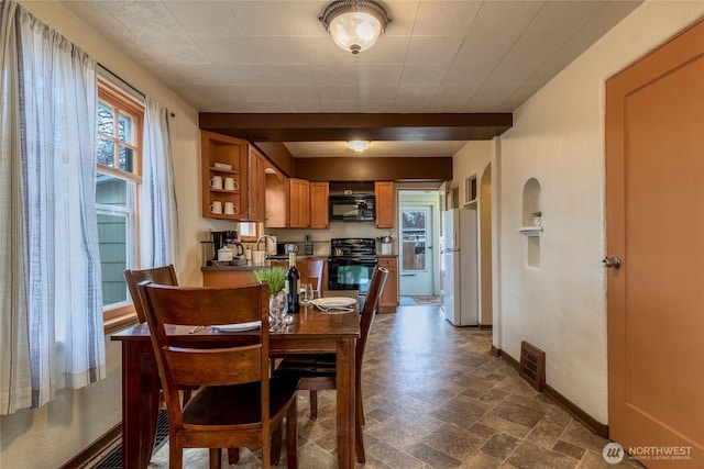 dining area with baseboards and visible vents