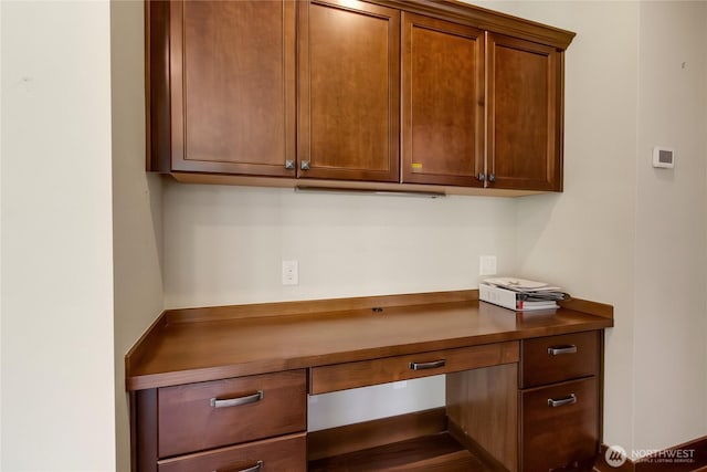 unfurnished office with built in study area