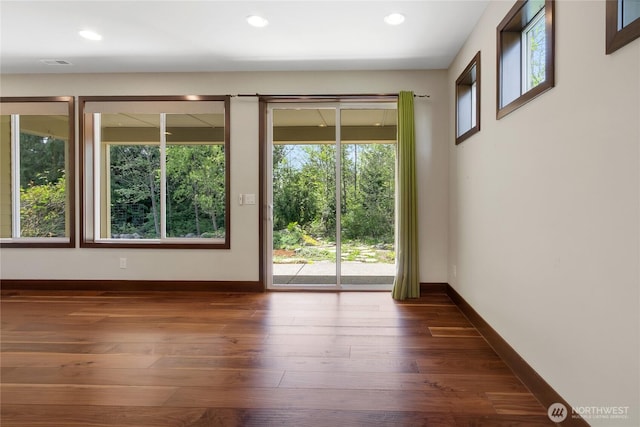 doorway to outside with recessed lighting, baseboards, dark wood-style floors, and visible vents
