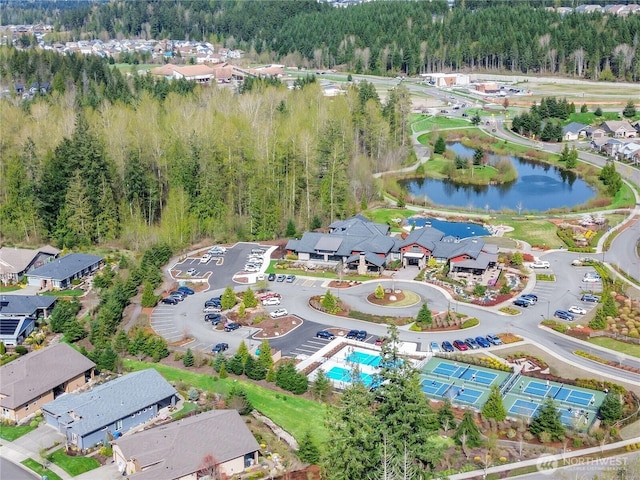 bird's eye view with a residential view, a water view, and a forest view