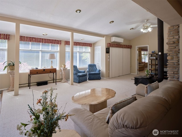 597 Yale Bridge Rd, Ariel, WA 98603 - carpeted living room with baseboards, ceiling fan, a wall unit AC, and lofted ceiling