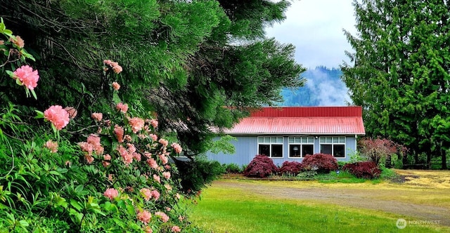 597 Yale Bridge Rd, Ariel, WA 98603 - view of property exterior featuring a lawn and metal roof