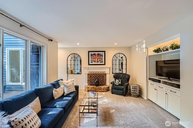 3123 240th Ave NE, Sammamish, WA 98074 - living room featuring baseboards, a fireplace with raised hearth, and light carpet