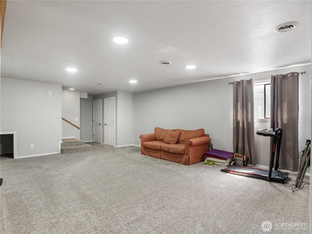 unfurnished living room featuring visible vents, stairs, baseboards, recessed lighting, and carpet flooring