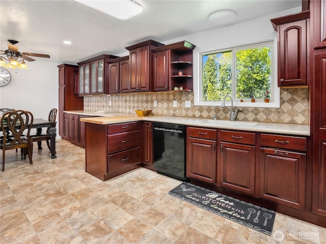 kitchen with a sink, ceiling fan, dishwasher, and light countertops
