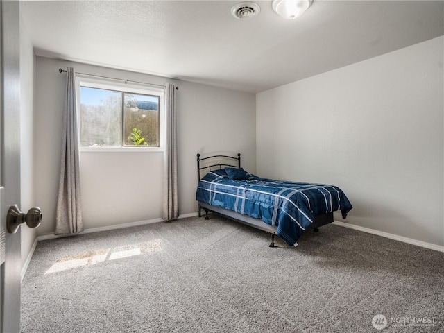 bedroom featuring carpet floors, baseboards, and visible vents
