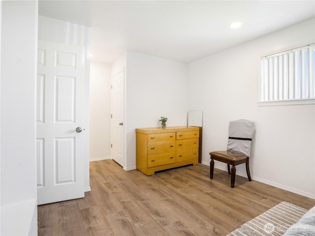 sitting room featuring light wood-style floors, recessed lighting, and baseboards