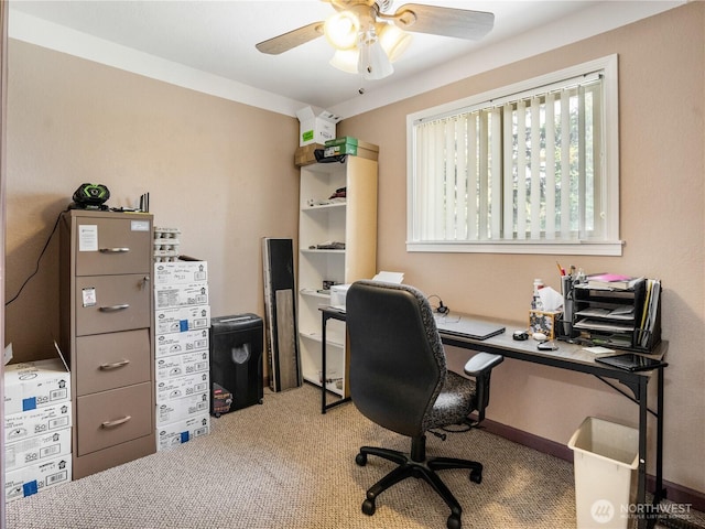 carpeted office featuring a ceiling fan
