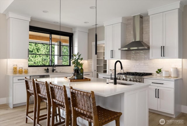 4306 Quaternary Rd, Clinton, WA 98236 - kitchen with wall chimney range hood, light countertops, a sink, and tasteful backsplash