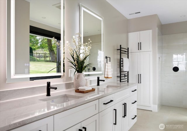4306 Quaternary Rd, Clinton, WA 98236 - bathroom with a sink, tiled shower, double vanity, and visible vents