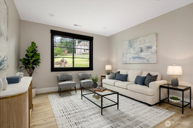 4306 Quaternary Rd, Clinton, WA 98236 - living room featuring visible vents, light wood finished floors, and baseboards
