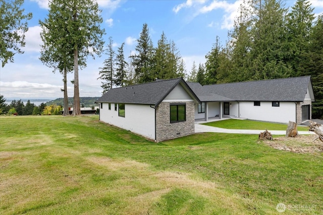 4306 Quaternary Rd, Clinton, WA 98236 - rear view of property with a yard and roof with shingles