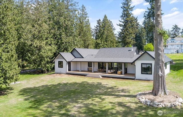 4306 Quaternary Rd, Clinton, WA 98236 - back of property featuring a lawn and roof with shingles