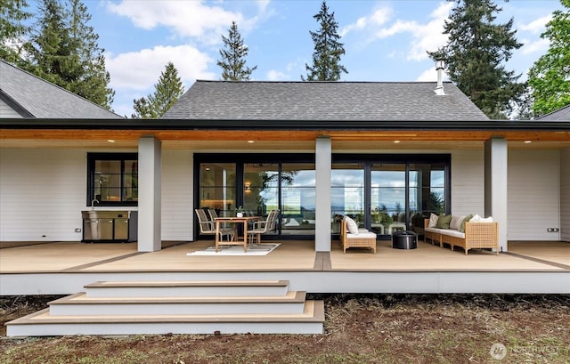 4306 Quaternary Rd, Clinton, WA 98236 - back of house with a deck, an outdoor living space, outdoor dining space, and roof with shingles