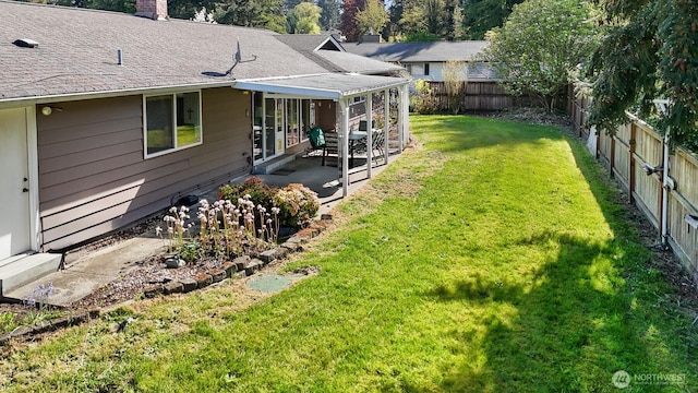 view of yard with a fenced backyard and a patio