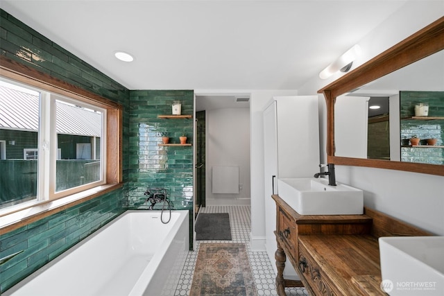 209 W 3rd St, Cle Elum, WA 98922 - bathroom featuring tile patterned floors, a washtub, vanity, and visible vents
