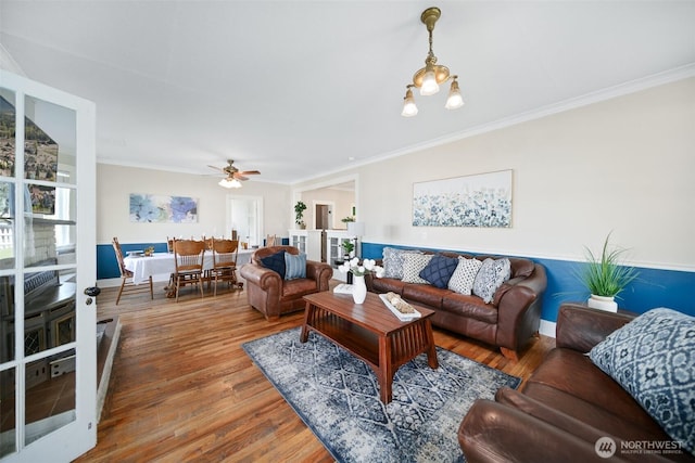 209 W 3rd St, Cle Elum, WA 98922 - living room with baseboards, ornamental molding, a ceiling fan, and wood finished floors