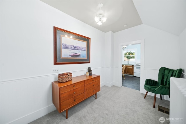 209 W 3rd St, Cle Elum, WA 98922 - sitting room featuring baseboards, light colored carpet, a wainscoted wall, a chandelier, and vaulted ceiling
