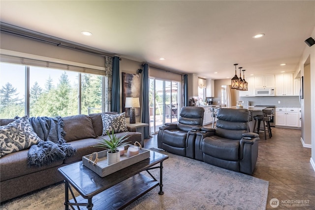 tiled living room with recessed lighting