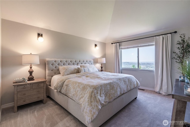 bedroom featuring baseboards, visible vents, light carpet, and lofted ceiling
