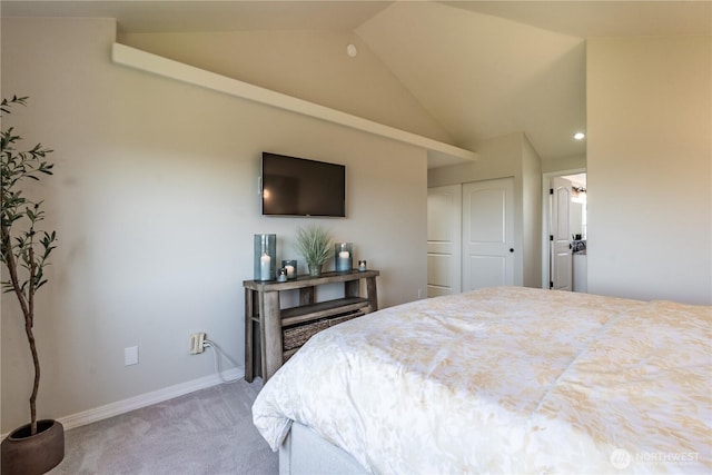 bedroom with a closet, baseboards, light colored carpet, recessed lighting, and vaulted ceiling