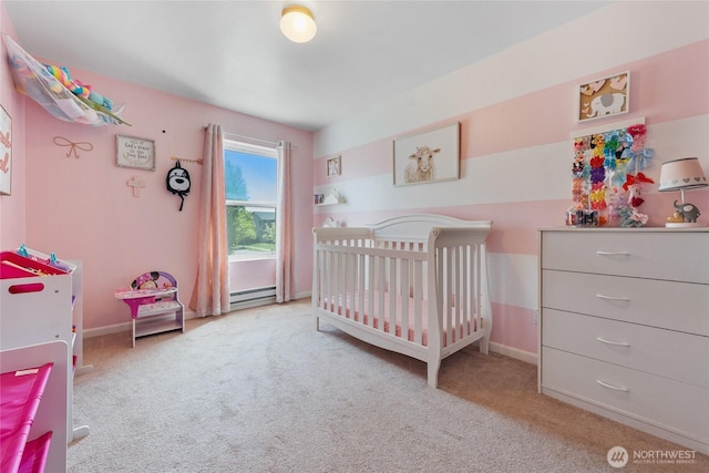 bedroom featuring carpet flooring, baseboards, a crib, and baseboard heating