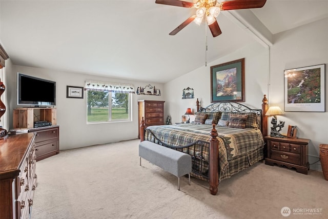 bedroom featuring ceiling fan, vaulted ceiling, and light carpet
