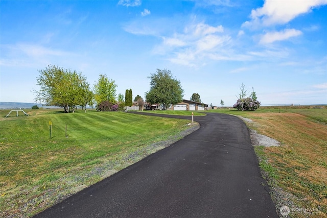 view of street with aphalt driveway