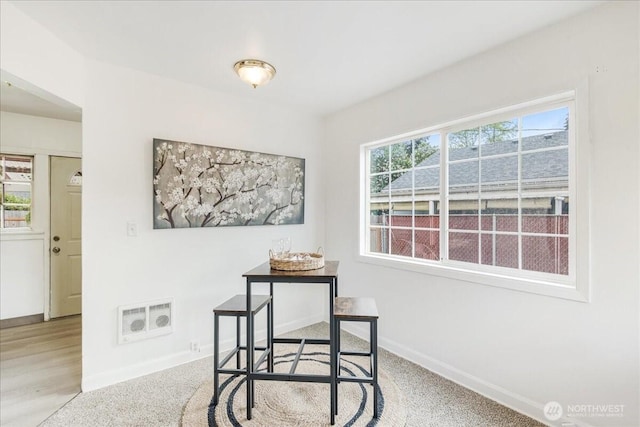 dining space with baseboards and visible vents