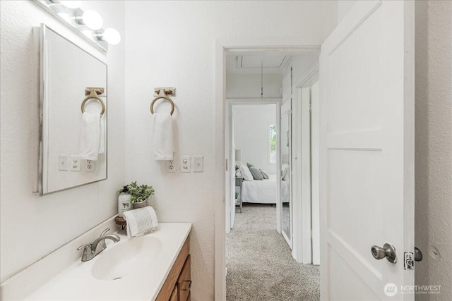 bathroom with vanity and ensuite bathroom