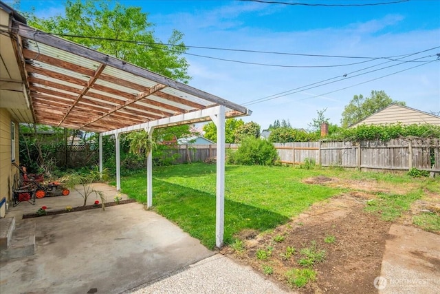 view of yard featuring a patio, a fenced backyard, and a pergola