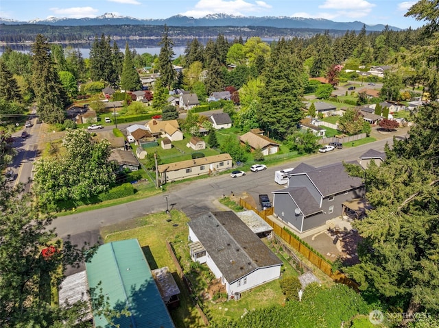 birds eye view of property with a water and mountain view and a residential view
