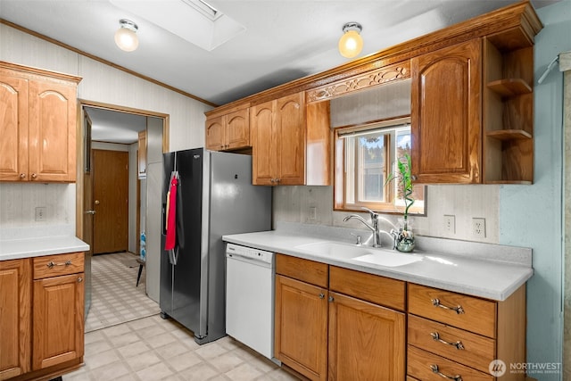 kitchen with white dishwasher, crown molding, a sink, light countertops, and light floors