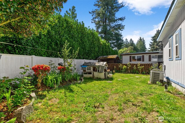 view of yard featuring a fenced backyard and cooling unit