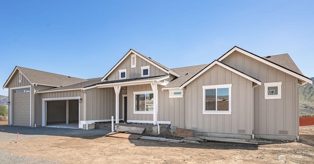 642 S Juli Ave, East Wenatchee, WA 98802 - view of front of home with a shingled roof, an attached garage, board and batten siding, and driveway