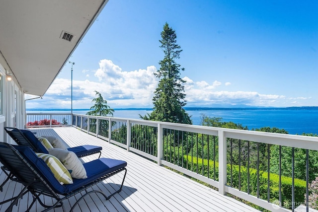 wooden deck featuring a water view