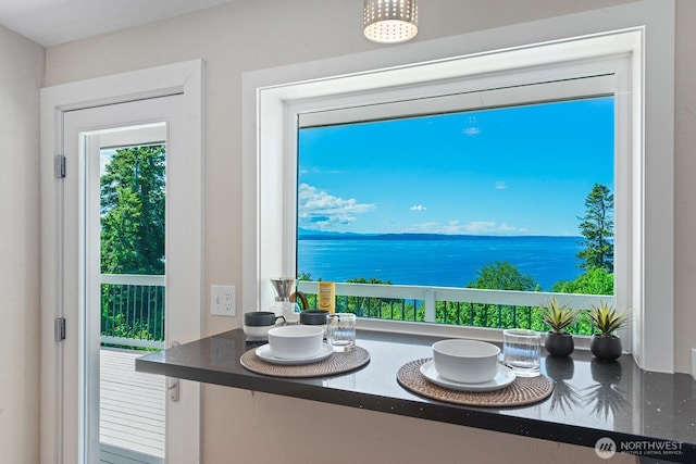 dining space featuring a water view