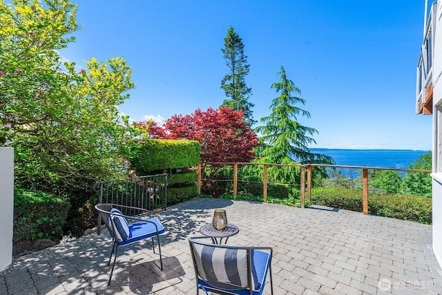 view of patio / terrace with a water view