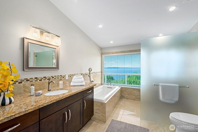 full bath with a garden tub, vanity, tile patterned floors, toilet, and recessed lighting