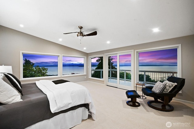 carpeted bedroom featuring vaulted ceiling, recessed lighting, a water view, ceiling fan, and baseboards