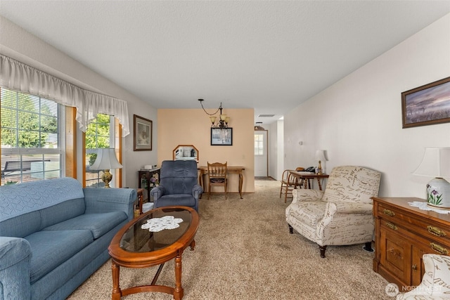 living area with light colored carpet and a healthy amount of sunlight
