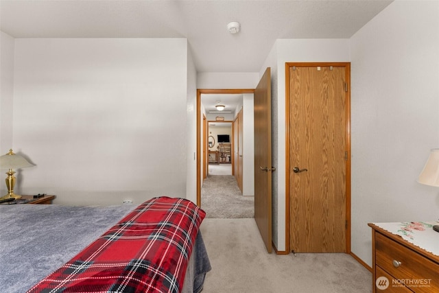 bedroom with light carpet