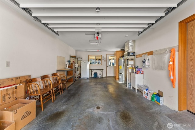 garage featuring freestanding refrigerator, strapped water heater, and a garage door opener